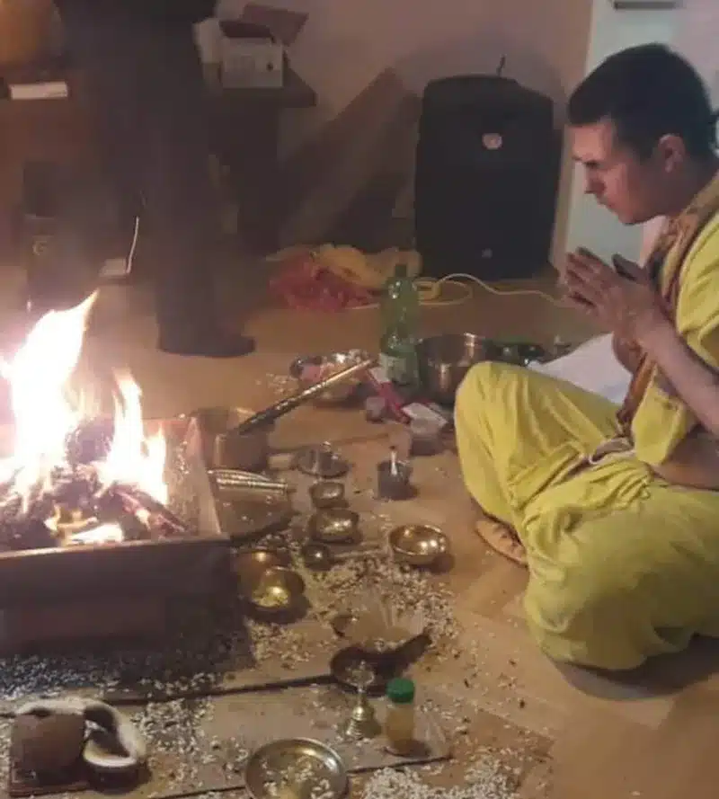 Vedic Homa with the sacred fire kindled and devotees gathered around it